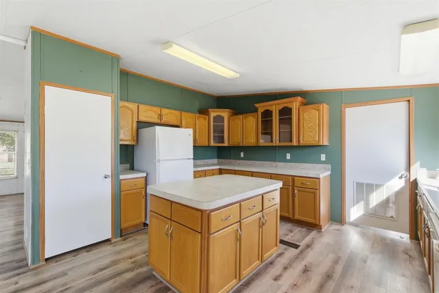 a kitchen that has a cabinets a sink and a stove in it