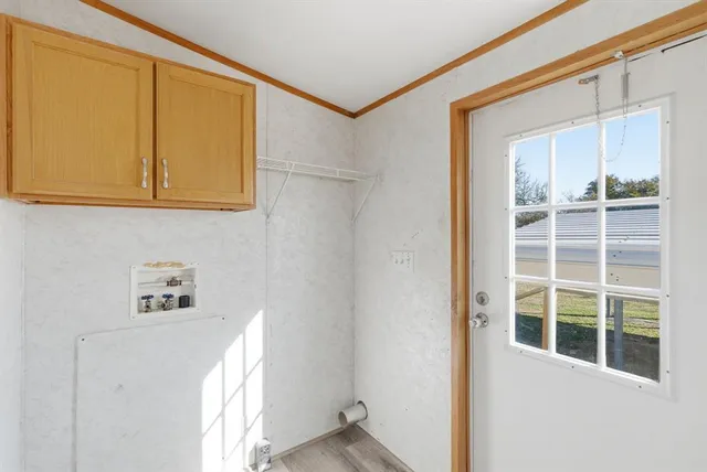 a view of kitchen with granite countertop cabinets