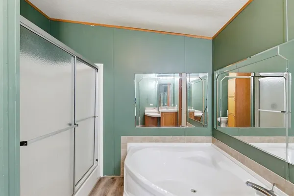 a bathroom with a bathtub and a sink