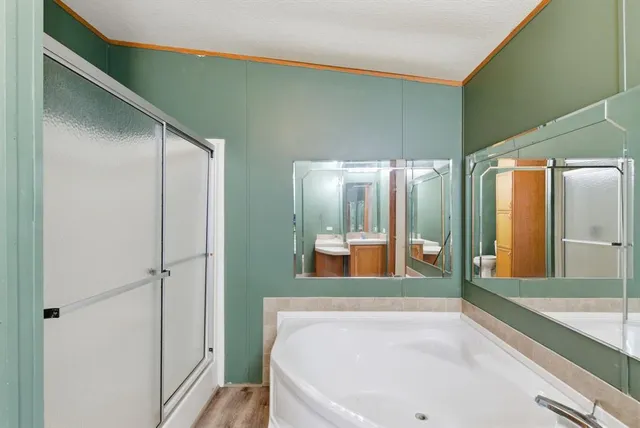 a bathroom with a bathtub and a sink