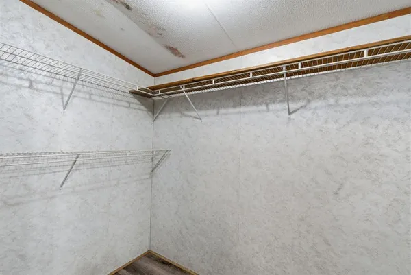 a view of a room with racks on the wall