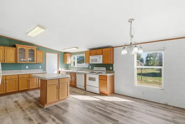 a kitchen with stainless steel appliances granite countertop a sink and stove