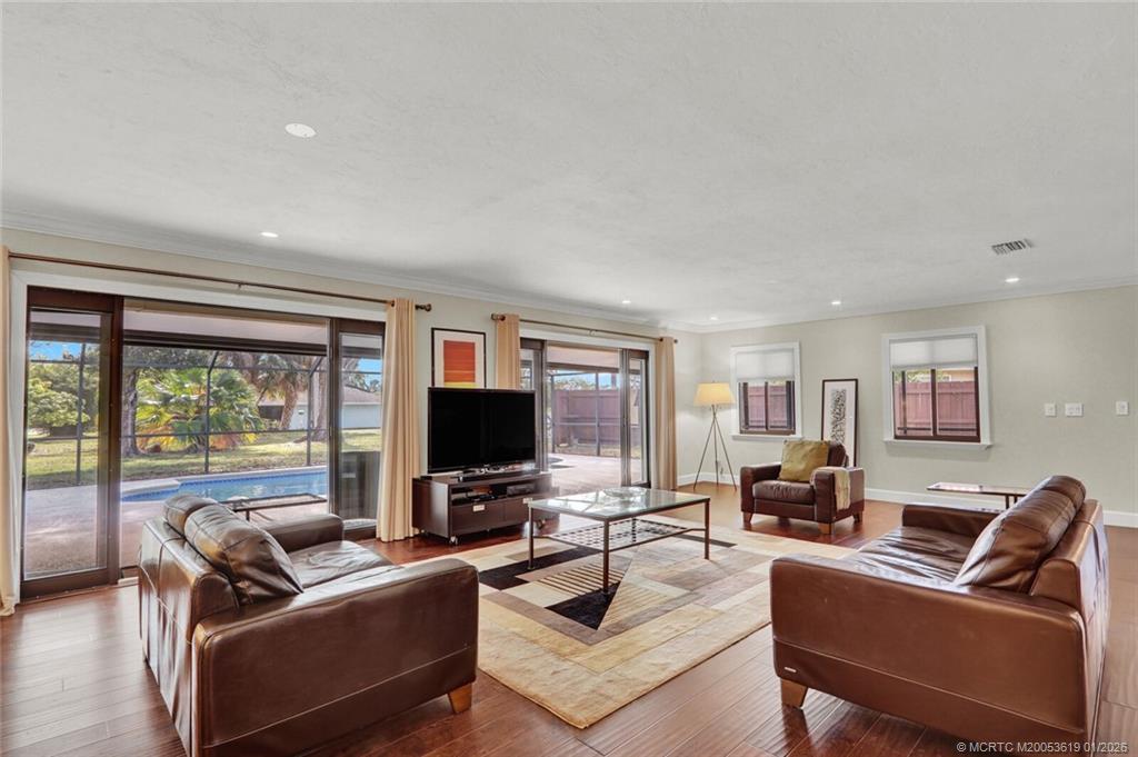 3060 Southeast Darien Road Port St. Lucie, FL 34952 - Photo 16 of 52 a living room with furniture and a flat screen tv
