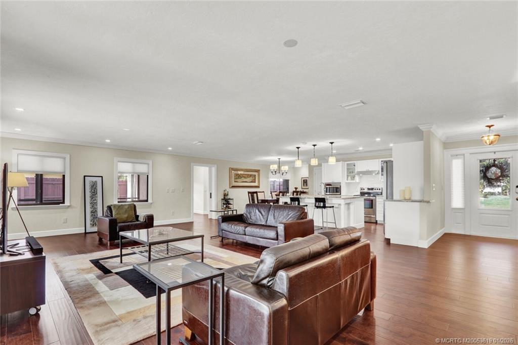 3060 Southeast Darien Road Port St. Lucie, FL 34952 - Photo 17 of 52 a living room with fireplace furniture and a wooden floor