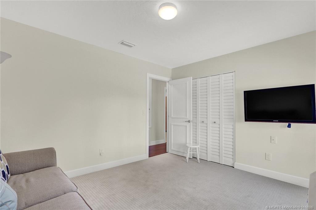 3060 Southeast Darien Road Port St. Lucie, FL 34952 - Photo 18 of 52 a view of room with furniture and a flat screen tv
