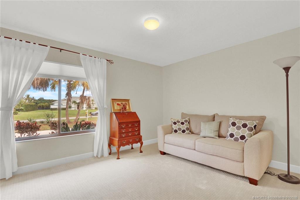 3060 Southeast Darien Road Port St. Lucie, FL 34952 - Photo 19 of 52 a living room with furniture and a large window