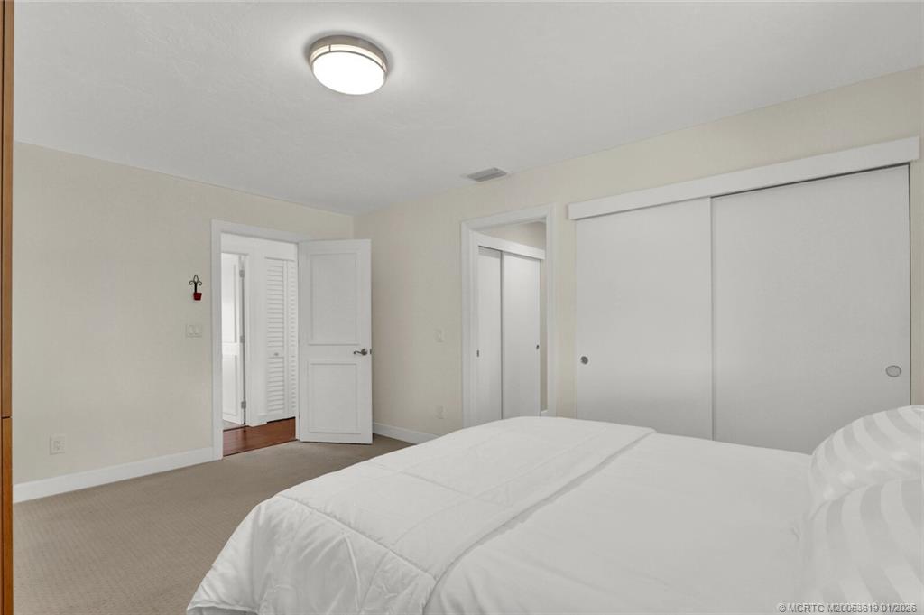 3060 Southeast Darien Road Port St. Lucie, FL 34952 - Photo 24 of 52 a bedroom with a bed and a window