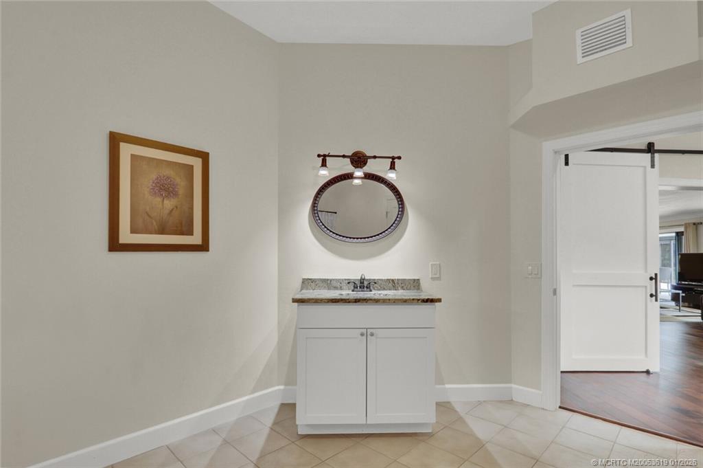 3060 Southeast Darien Road Port St. Lucie, FL 34952 - Photo 28 of 52 a room with a sink and a mirror