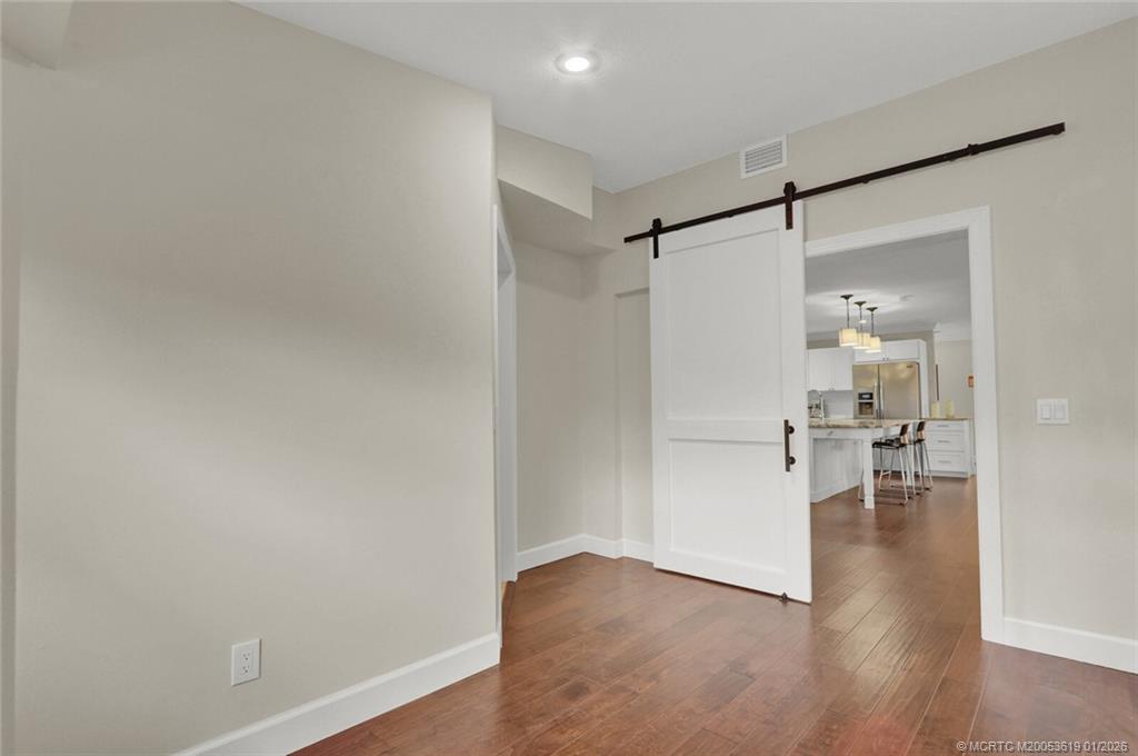 3060 Southeast Darien Road Port St. Lucie, FL 34952 - Photo 31 of 52 a view of empty room with wooden floor