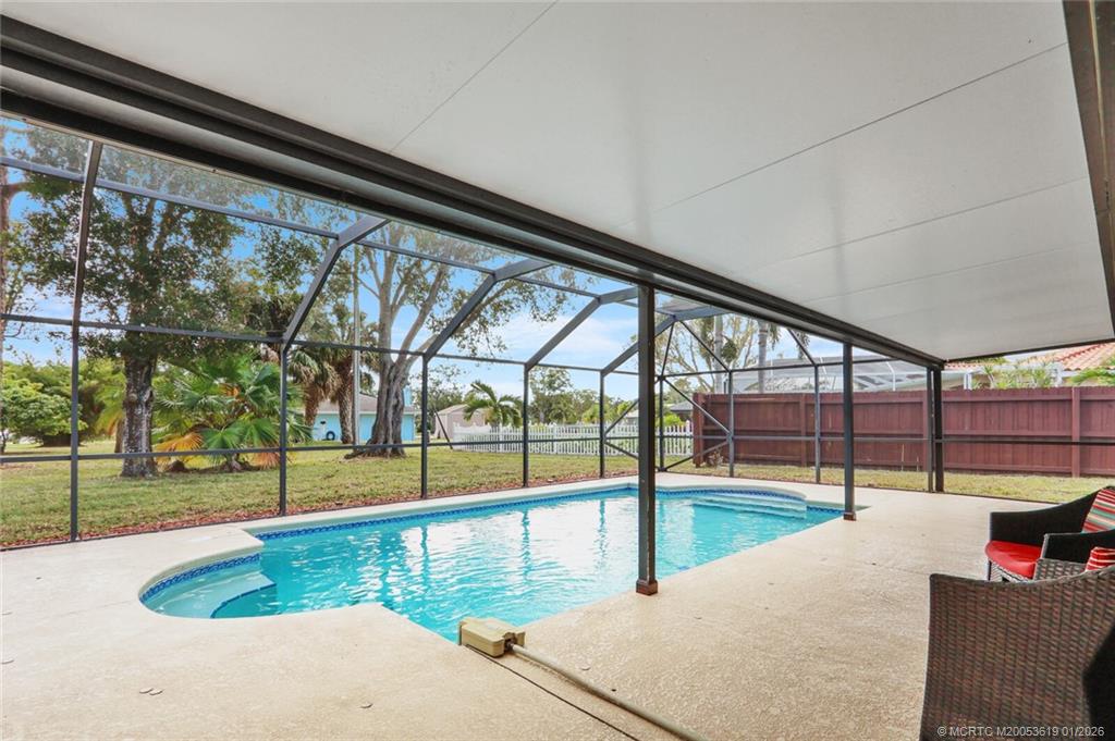 3060 Southeast Darien Road Port St. Lucie, FL 34952 - Photo 39 of 52 a view of a swimming pool with a patio