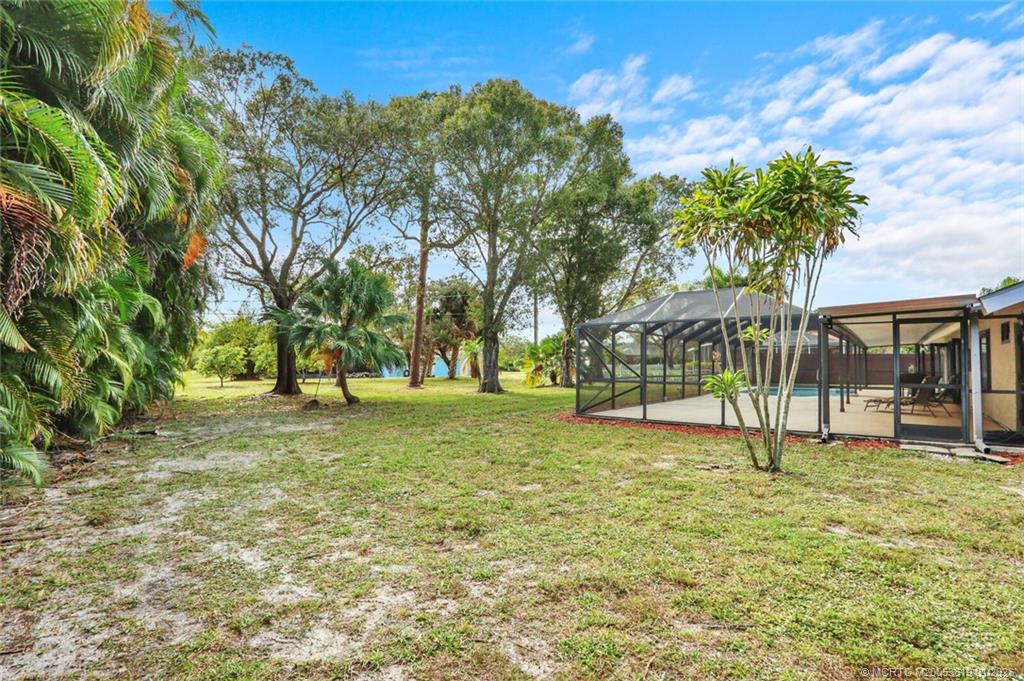 3060 Southeast Darien Road Port St. Lucie, FL 34952 - Photo 43 of 52 a view of outdoor space with a garden