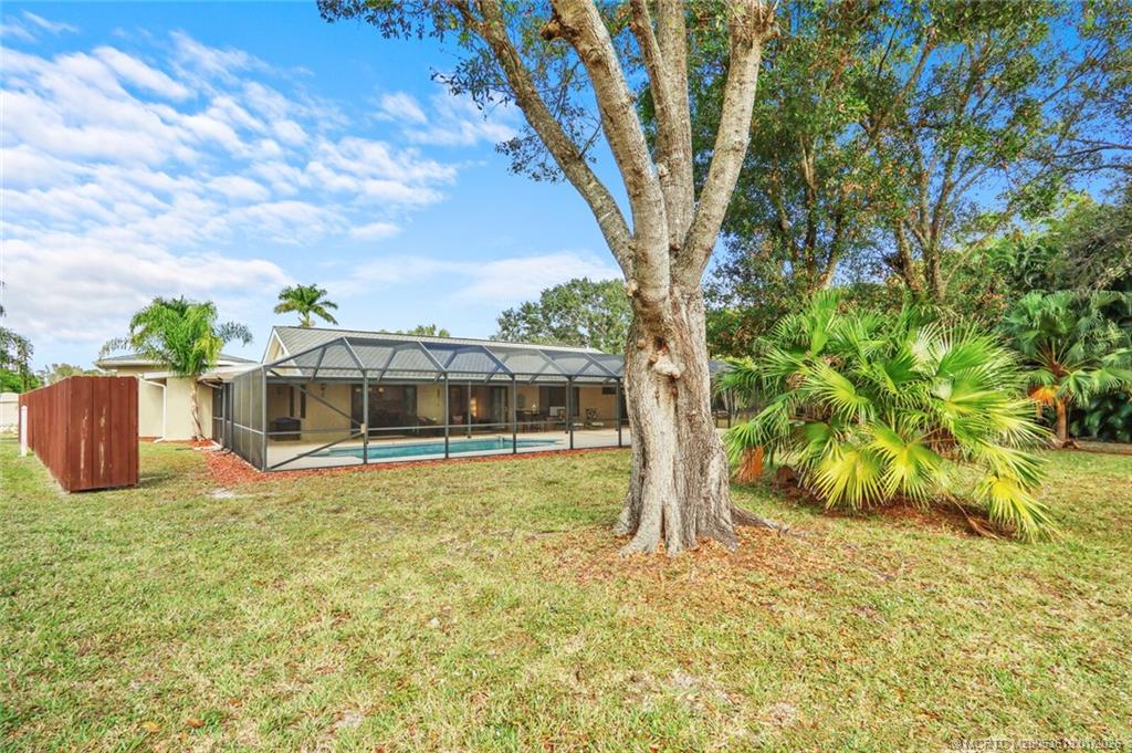3060 Southeast Darien Road Port St. Lucie, FL 34952 - Photo 46 of 52 a view of a house with a yard