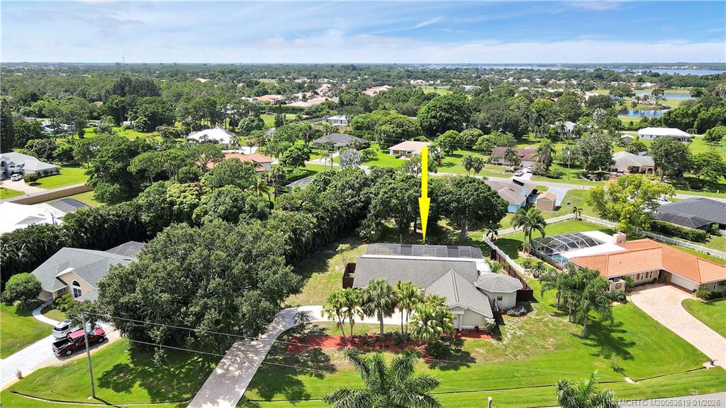 3060 Southeast Darien Road Port St. Lucie, FL 34952 - Photo 49 of 52 an aerial view of residential houses with outdoor space and trees all around
