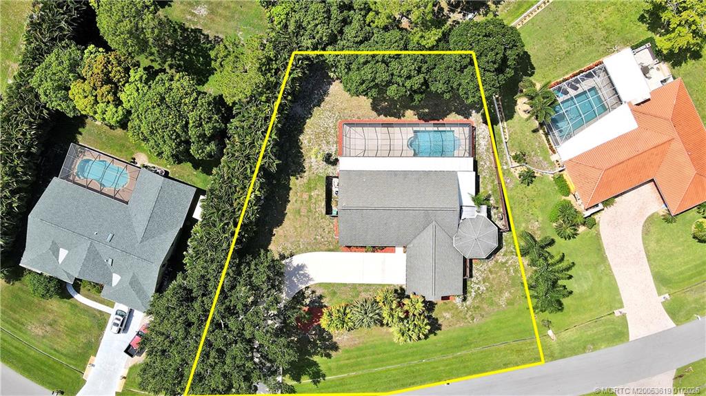 3060 Southeast Darien Road Port St. Lucie, FL 34952 - Photo 50 of 52 an aerial view of a house with a garden