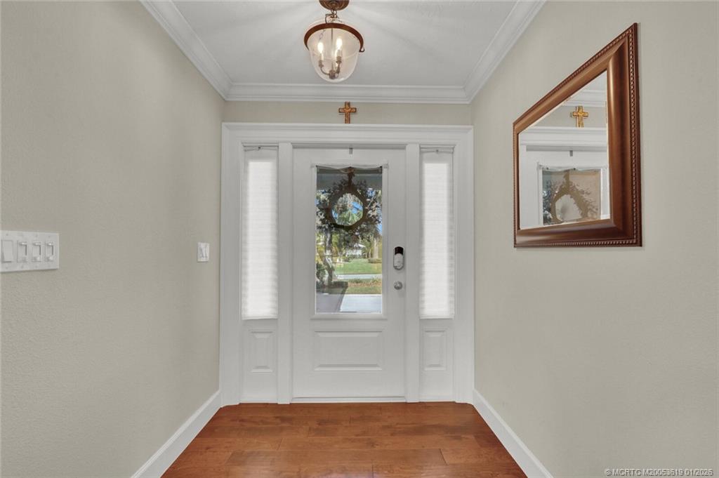 3060 Southeast Darien Road Port St. Lucie, FL 34952 - Photo 5 of 52 a view of an entryway with wooden floor