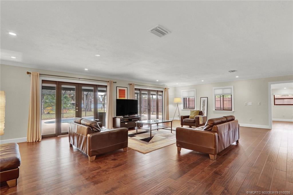 3060 Southeast Darien Road Port St. Lucie, FL 34952 - Photo 6 of 52 a living room with fireplace furniture and a flat screen tv