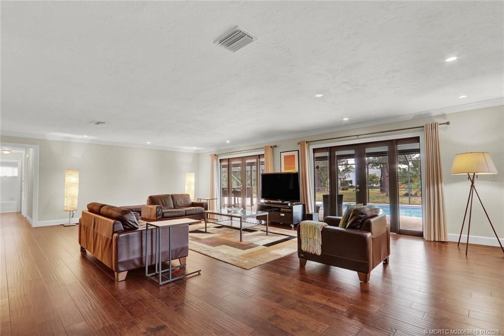 3060 Southeast Darien Road Port St. Lucie, FL 34952 - Photo 7 of 52 a living room with furniture and a flat screen tv