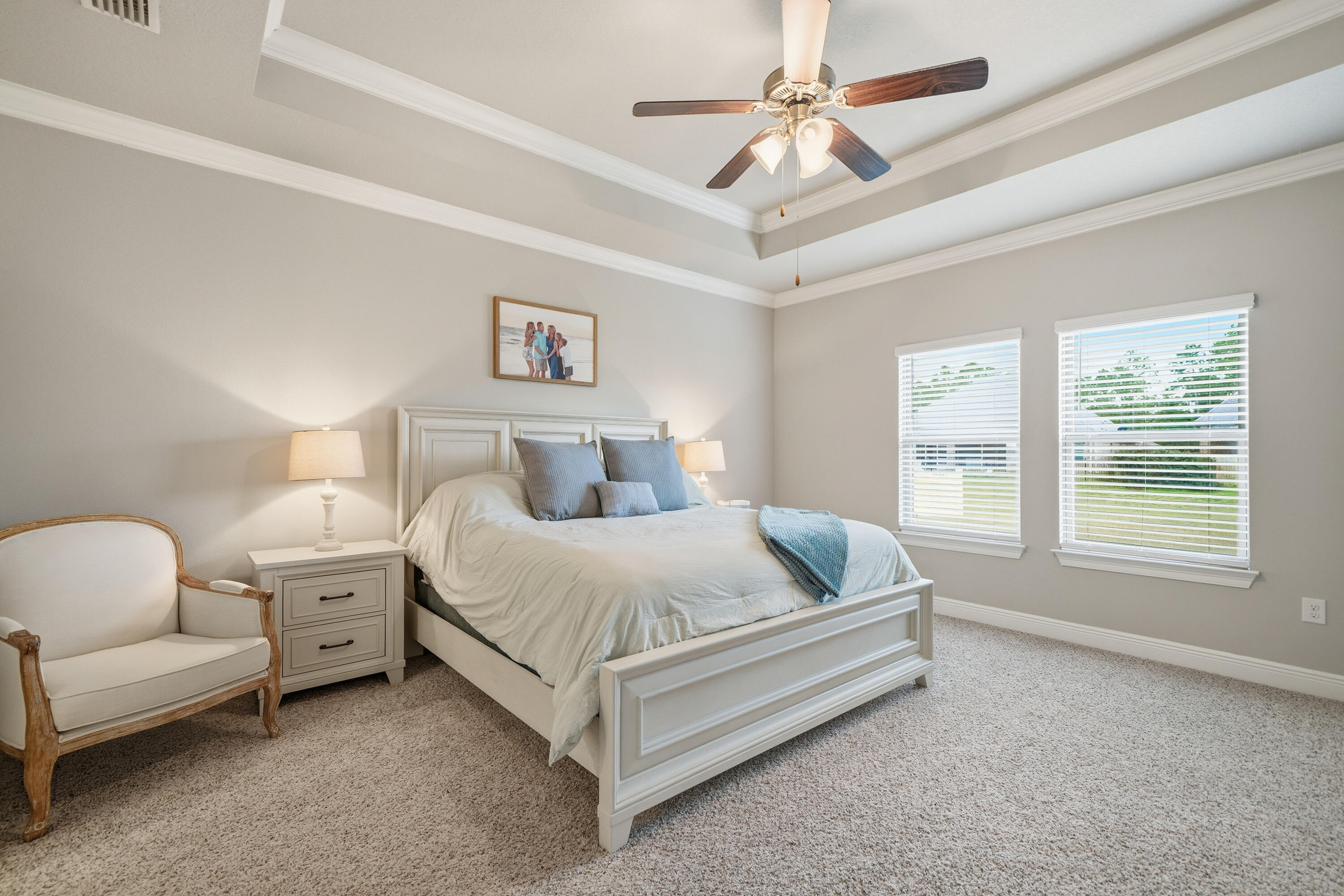 102 Wayne Trail Santa Rosa Beach, FL 32459 - Photo 16 of 35 a spacious bedroom with a bed and a couch