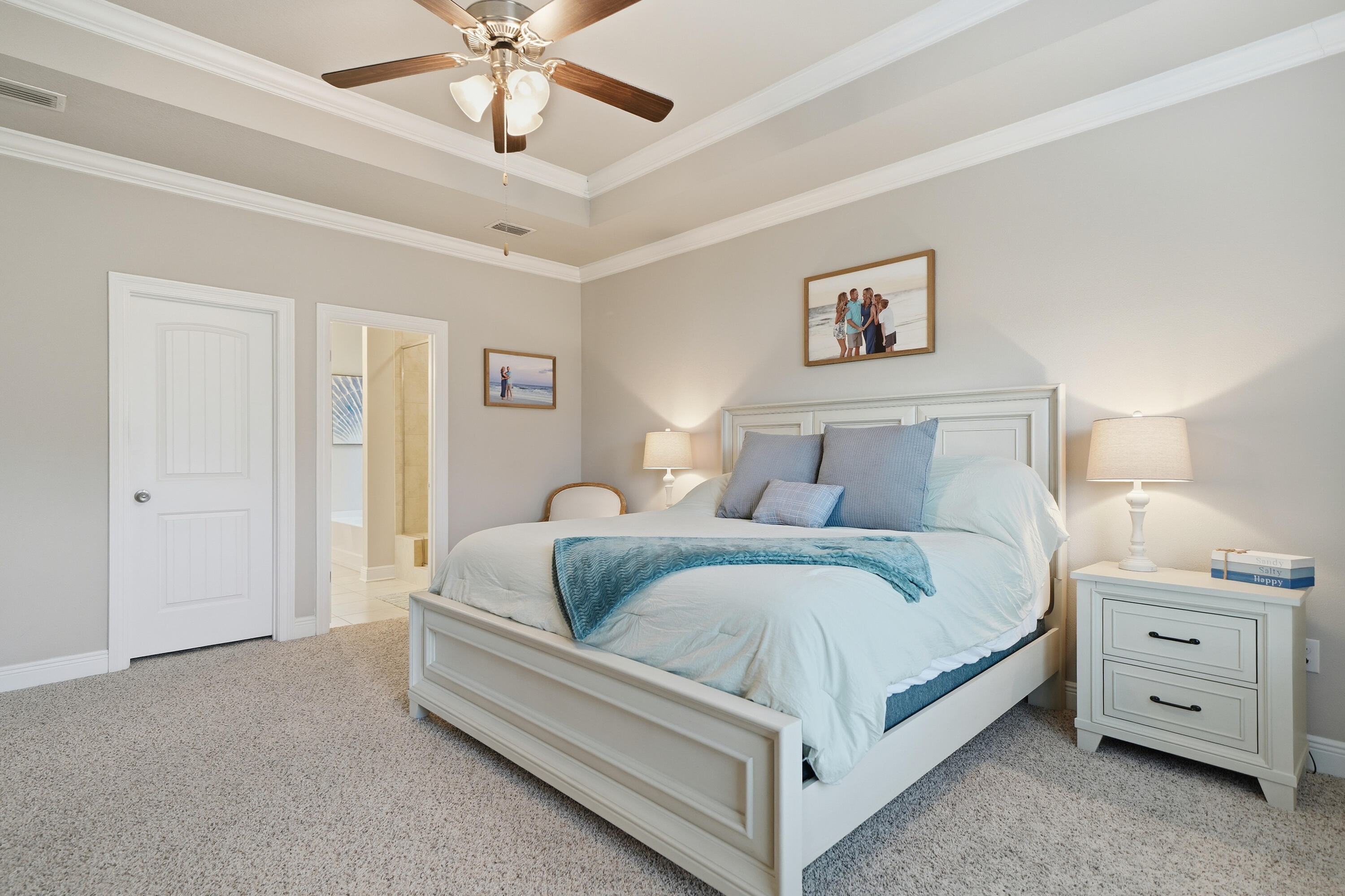 102 Wayne Trail Santa Rosa Beach, FL 32459 - Photo 17 of 35 a bedroom with bed and a chandelier