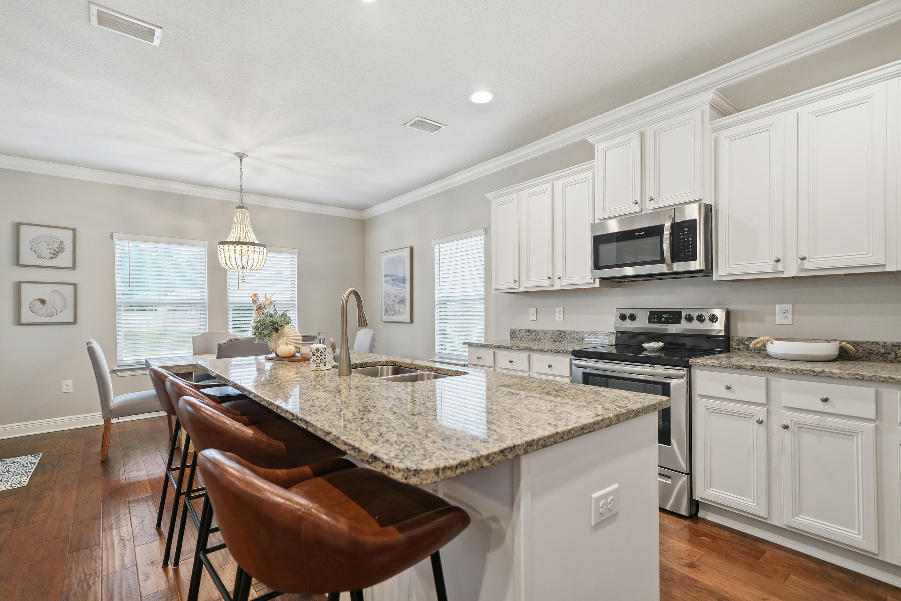 102 Wayne Trail Santa Rosa Beach, FL 32459 - Photo 6 of 35 a kitchen with sink cabinets and dining table