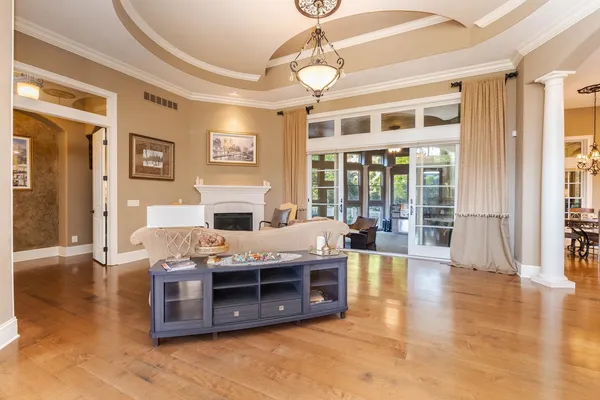 a kitchen with a stove and a chandelier
