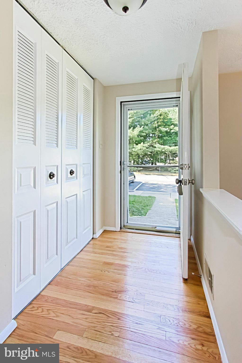 8317 Windfall Road Springfield, VA 22153 - Photo 2 of 19 a view of a room with wooden floor and windows