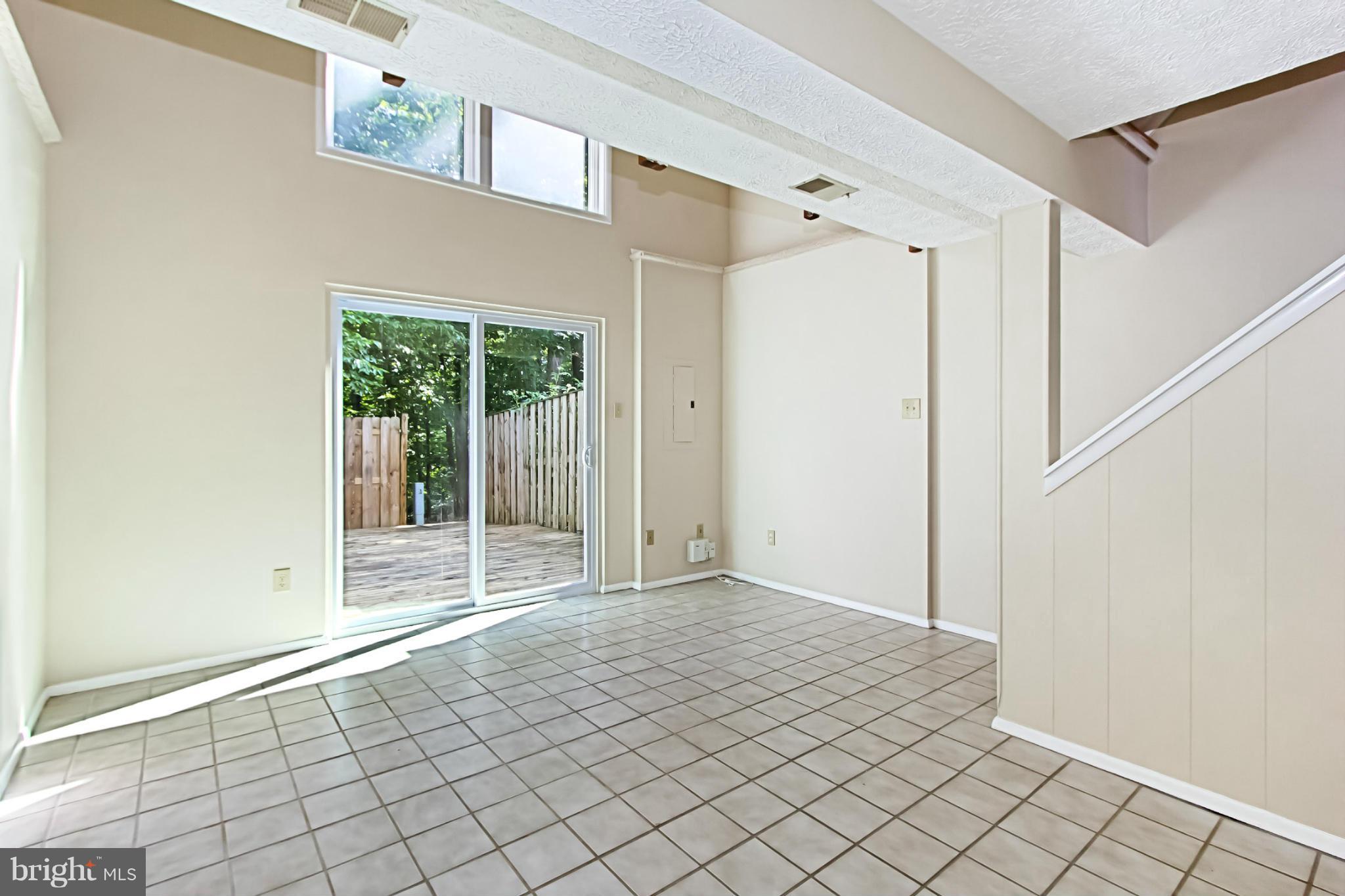 8317 Windfall Road Springfield, VA 22153 - Photo 13 of 19 a view of empty room with wooden floor and fan