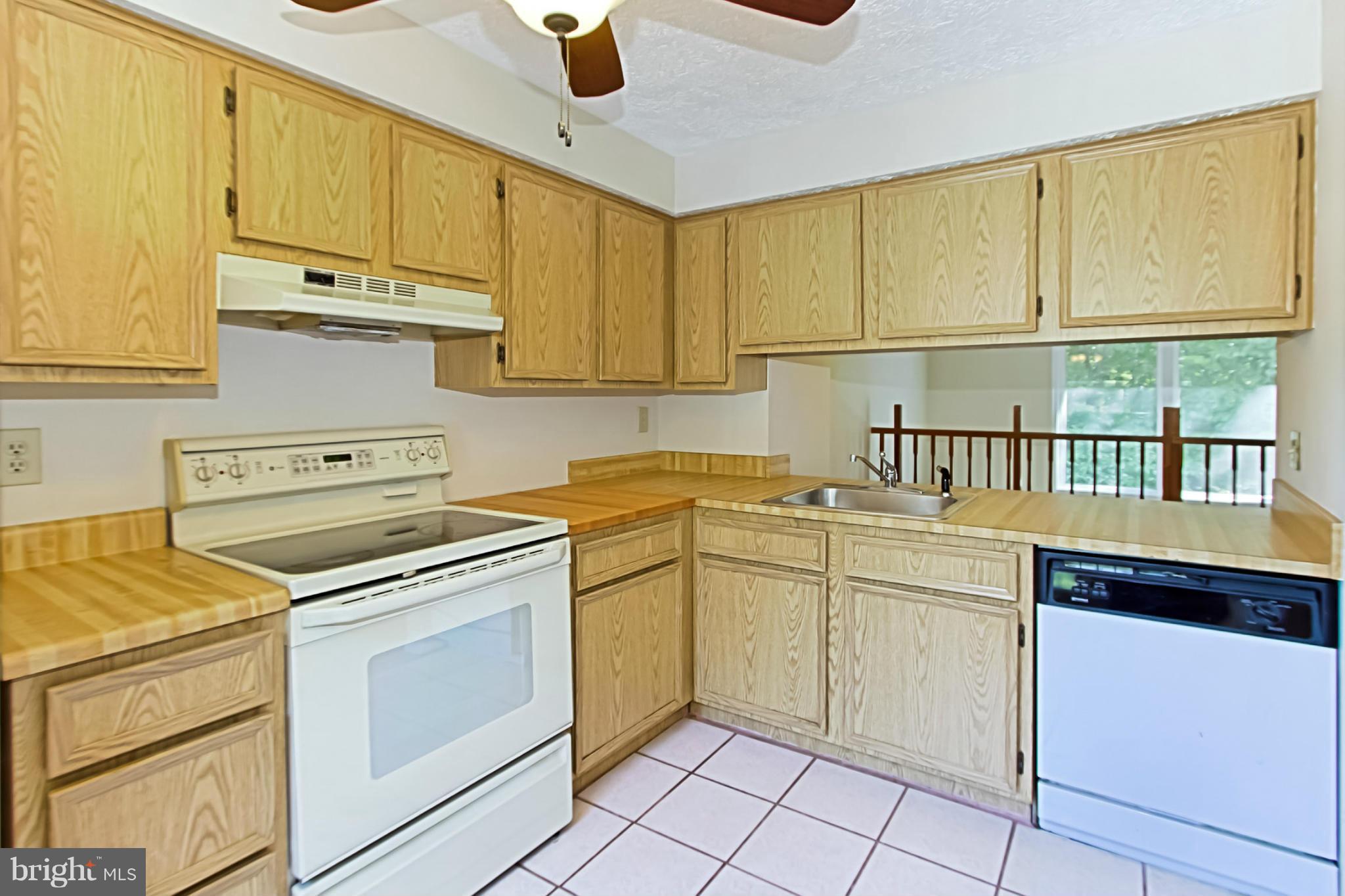 8317 Windfall Road Springfield, VA 22153 - Photo 6 of 19 a kitchen with cabinets appliances and a sink
