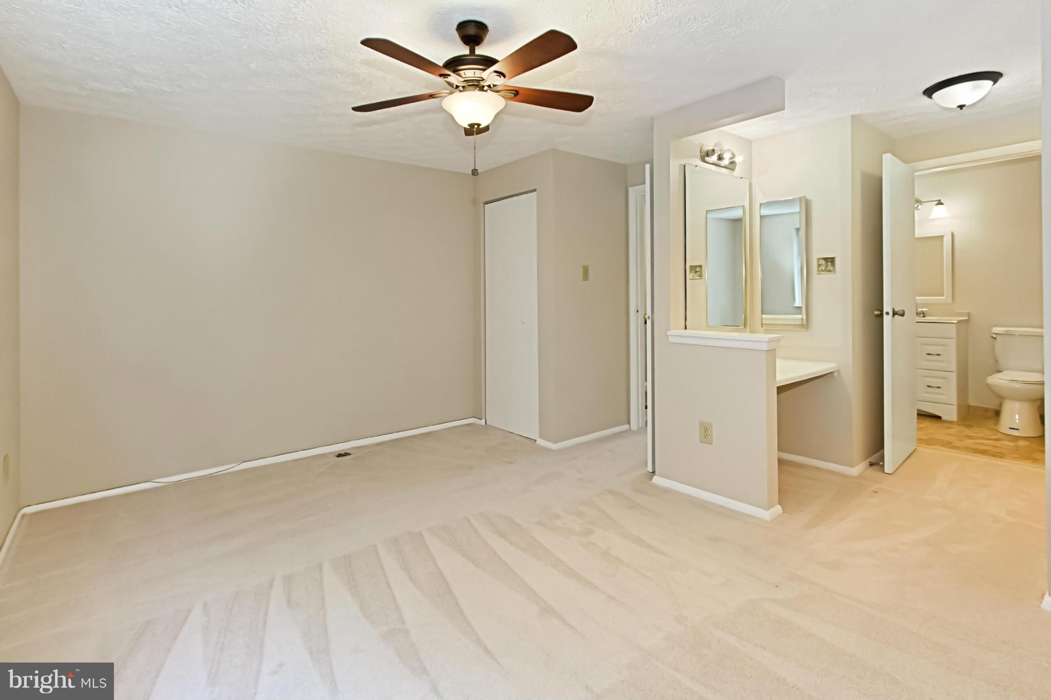 8317 Windfall Road Springfield, VA 22153 - Photo 8 of 19 an empty room with closet and a ceiling fan