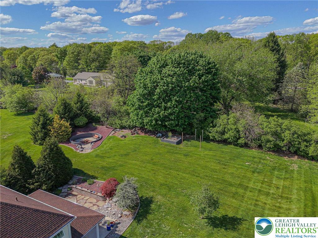 6551 Overlook Road Orefield, PA 18069 - Photo 76 of 82 a view of a lush green outdoor space with a swimming pool and valleys