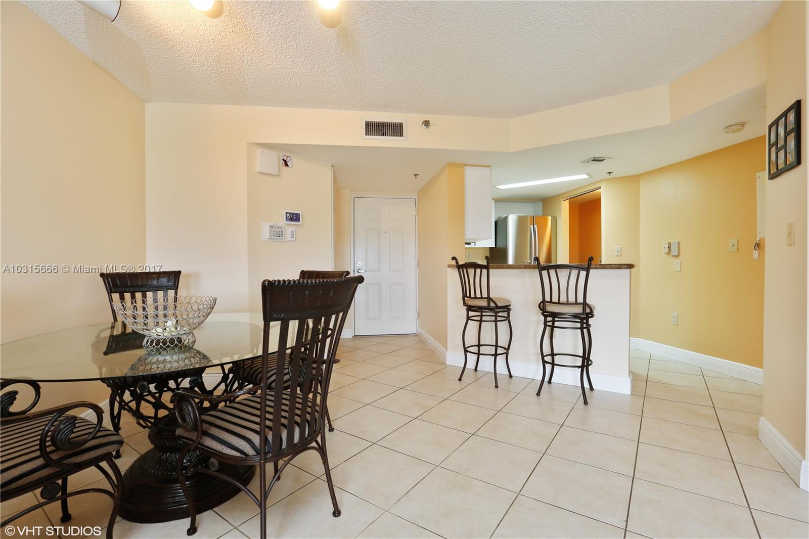 2351 Douglas Road, Unit 1110 Miami, FL 33145 - Photo 3 of 10 a view of a dining room with furniture