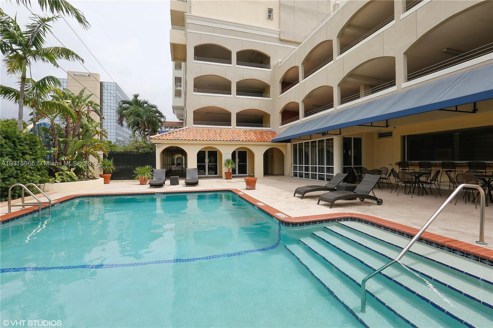 2351 Douglas Road, Unit 1110 Miami, FL 33145 - Photo 8 of 10 a view of a swimming pool with a patio