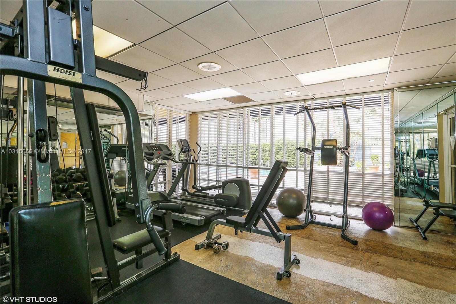 2351 Douglas Road, Unit 1110 Miami, FL 33145 - Photo 9 of 10 a view of a room with gym equipment