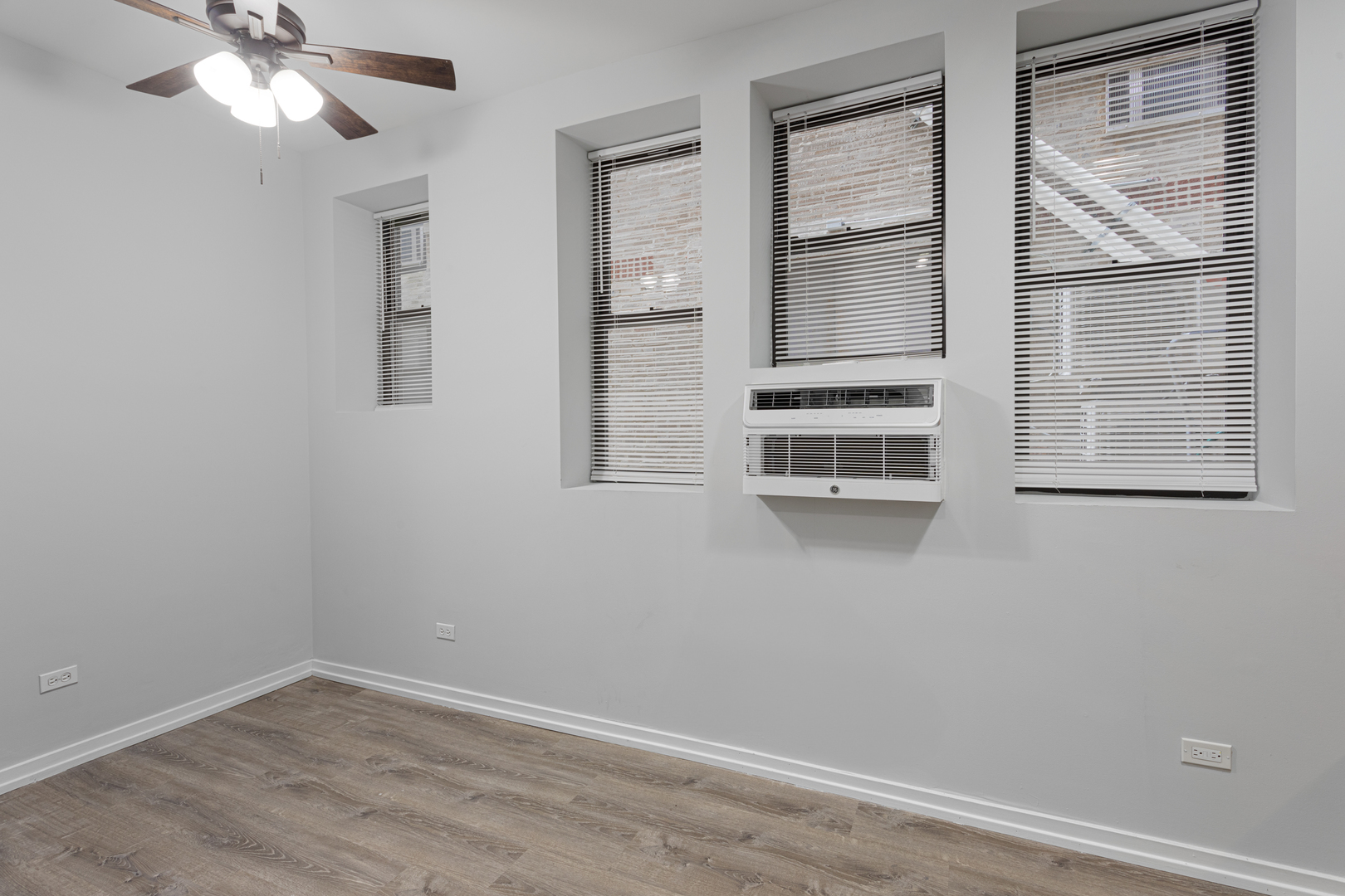 4875 North Magnolia Avenue, Unit 113 Chicago, IL 60640 - Photo 3 of 8 a view of an empty room with a window