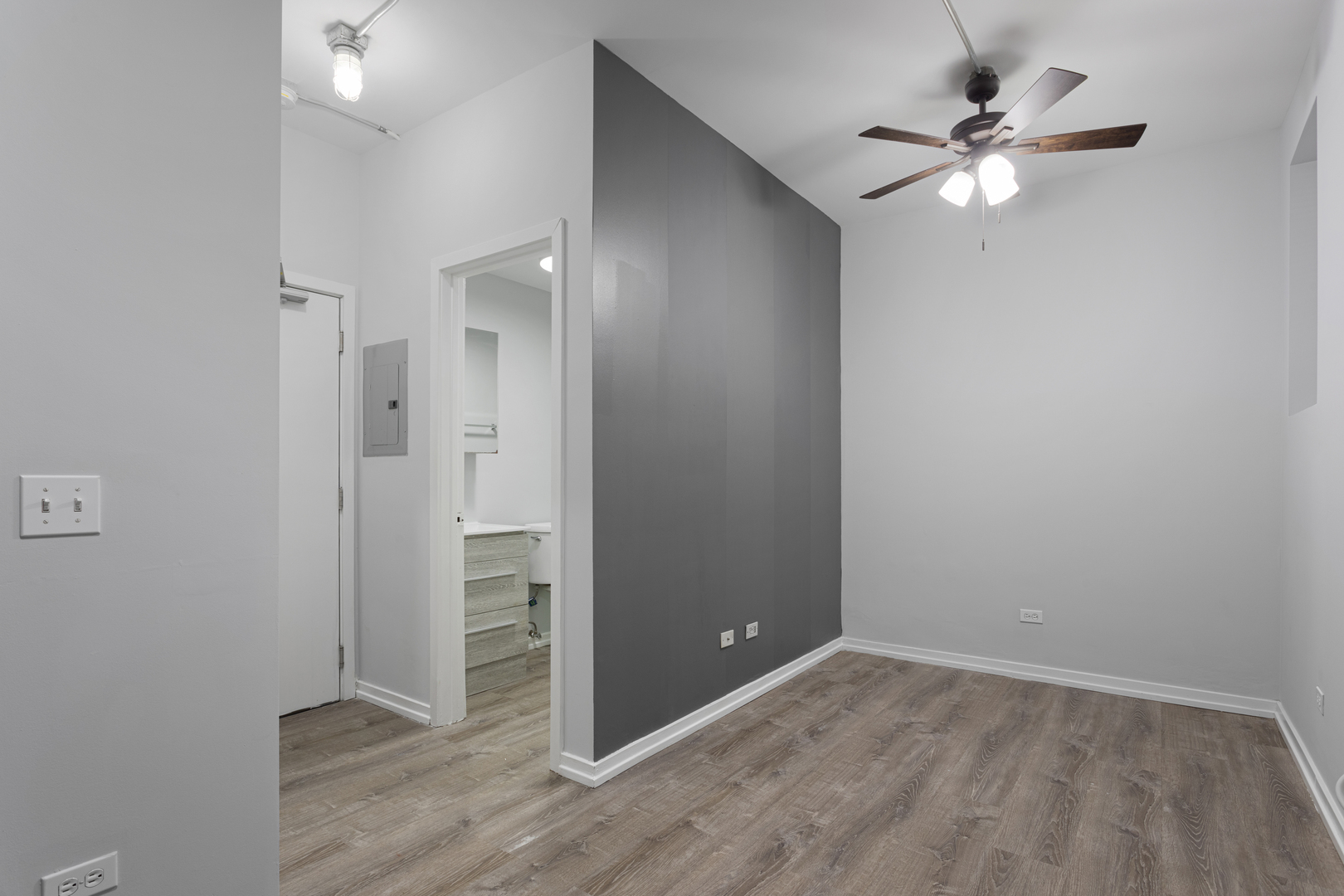 4875 North Magnolia Avenue, Unit 113 Chicago, IL 60640 - Photo 4 of 8 an empty room with closet and a ceiling fan