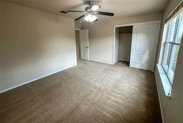 a bathroom with a tub a rug and a shower