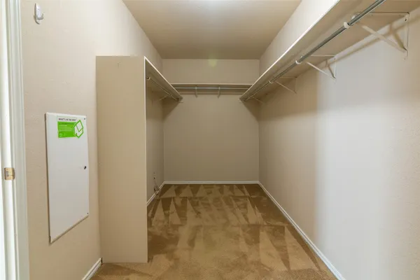 an empty room with a empty space and a ceiling fan