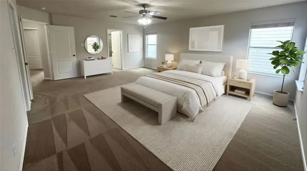 a bedroom with a bed and a potted plant