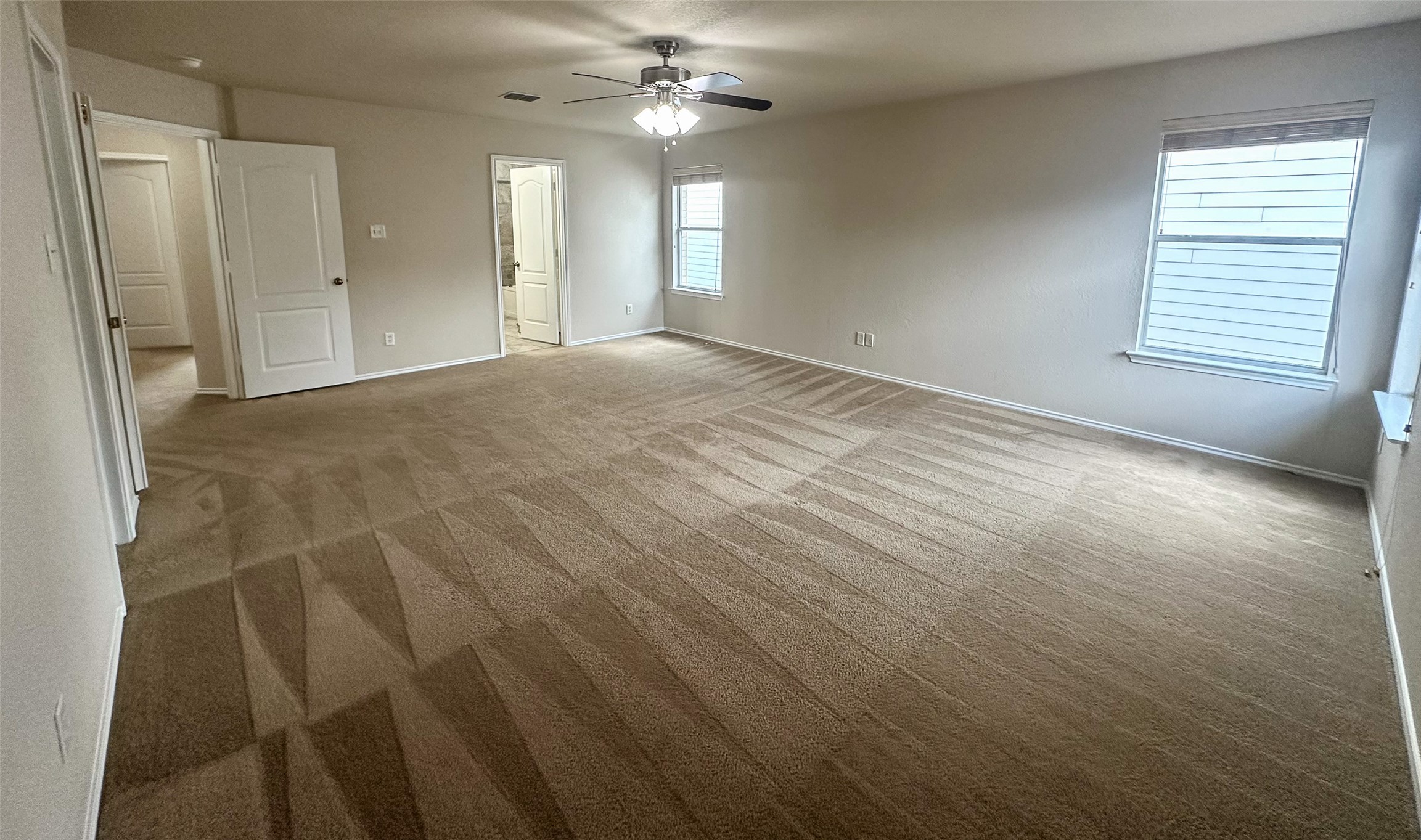 6741 Wayman Ridge San Antonio, TX 78233 - Photo 6 of 21 an empty room with windows and fan