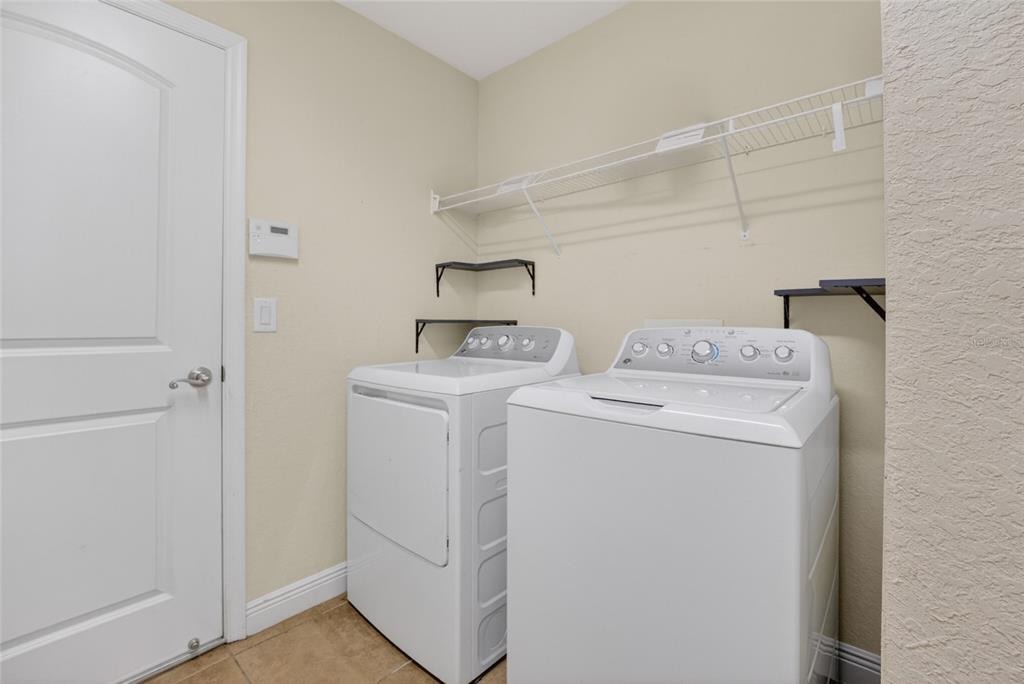 4319 Southwest 63rd Street Ocala, FL 34474 - Photo 24 of 29 a utility room with dryer and washer