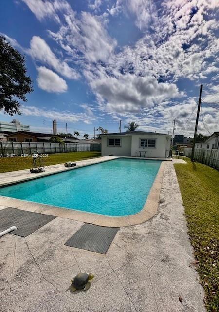 7215 Southwest 23rd Street Miami, FL 33155 - Photo 2 of 10 a view of a swimming pool with an ocean view