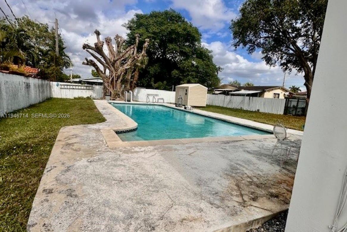 7215 Southwest 23rd Street Miami, FL 33155 - Photo 3 of 10 a view of a backyard with swimming pool