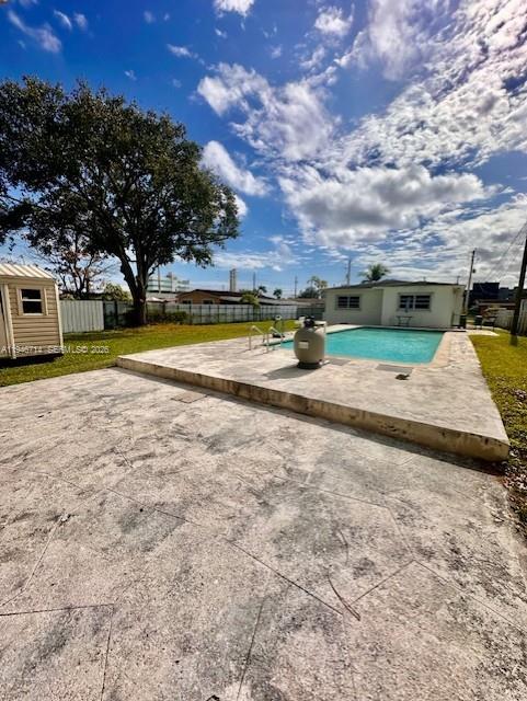 7215 Southwest 23rd Street Miami, FL 33155 - Photo 5 of 10 a view of yard with swimming pool and green space