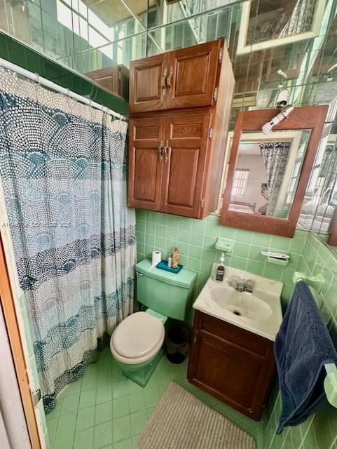 7215 Southwest 23rd Street Miami, FL 33155 - Photo 10 of 10 a bathroom with a sink mirror and toilet