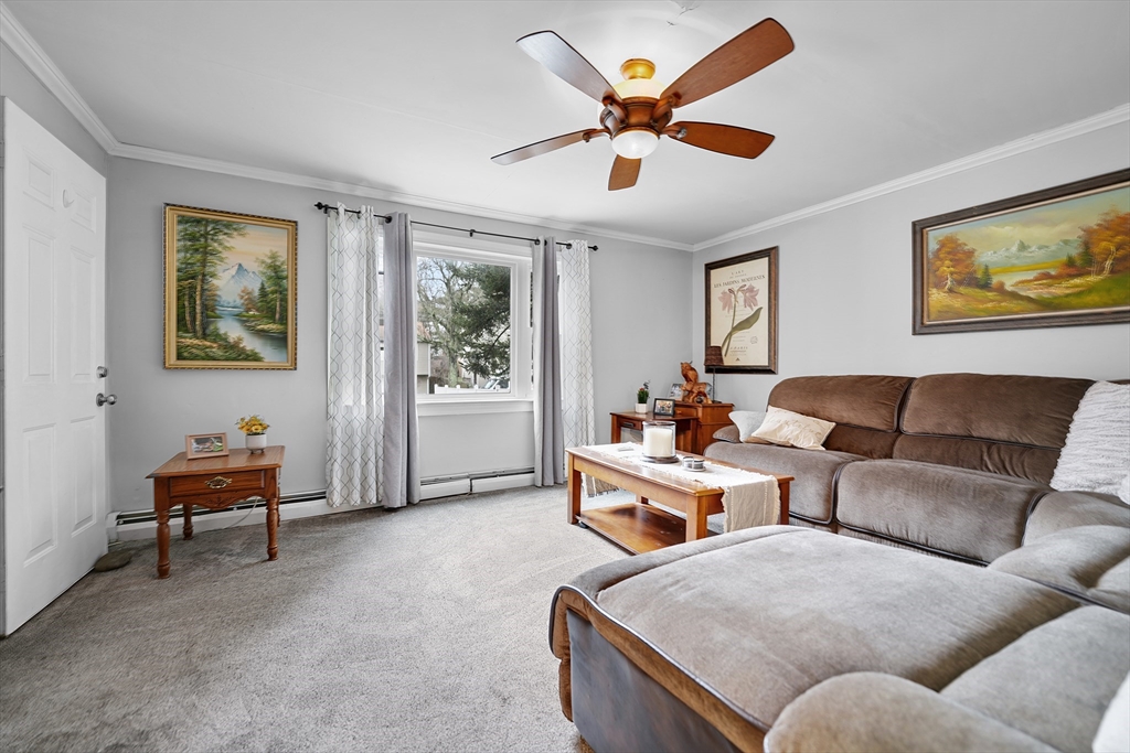 461 Snell Street Fall River, MA 02721 - Photo 4 of 25 a living room with furniture and a large window