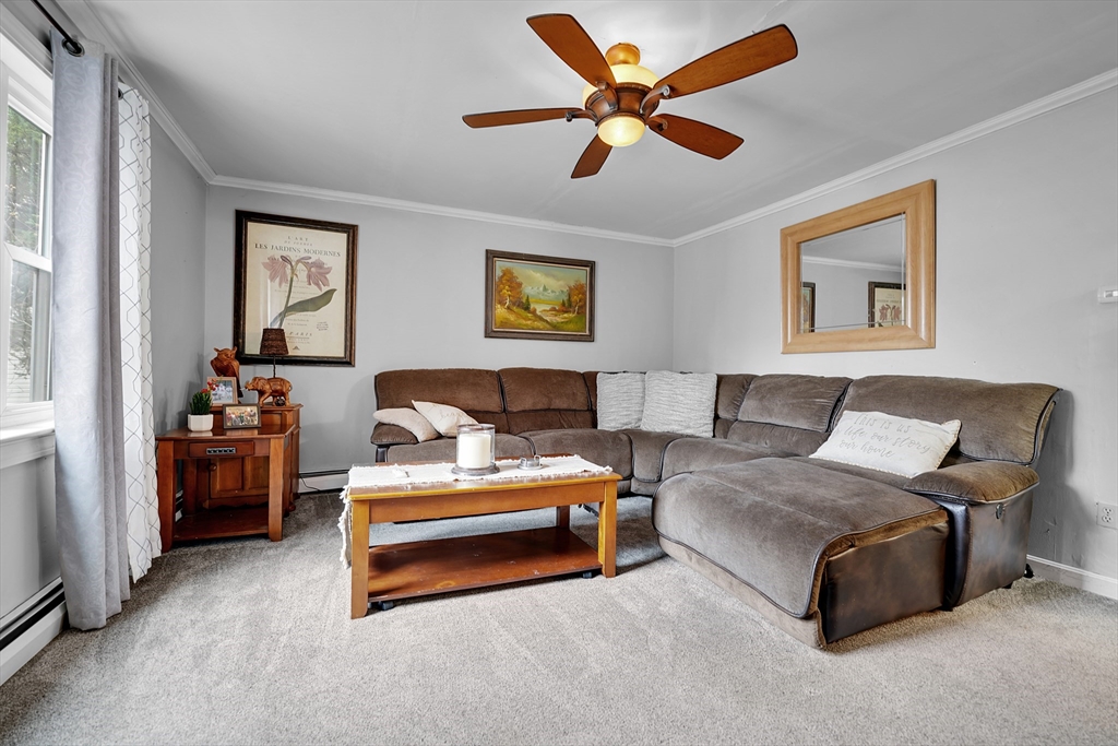 461 Snell Street Fall River, MA 02721 - Photo 6 of 25 a spacious bedroom with a bed and a couch