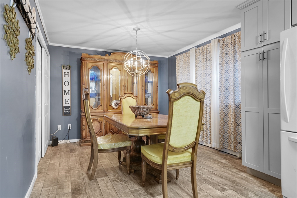 461 Snell Street Fall River, MA 02721 - Photo 10 of 25 a view of a dining room with furniture and chandelier