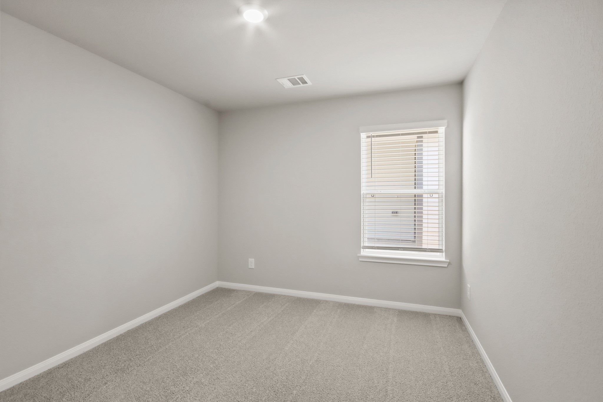 9227 Grace Rdg Drive Willis, TX 77318 - Photo 13 of 23 an empty room with a window