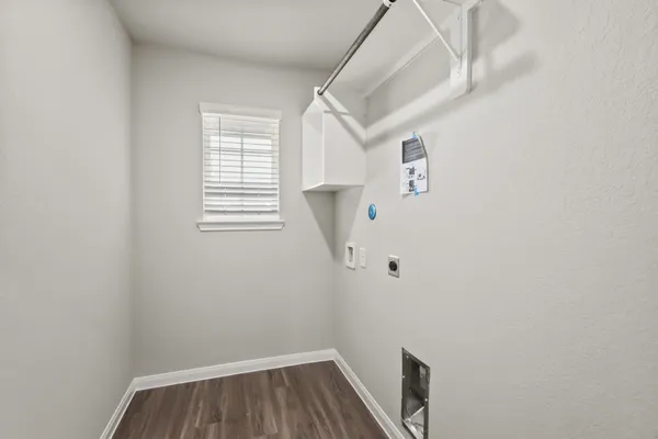 a view of room with window and hardwood floor
