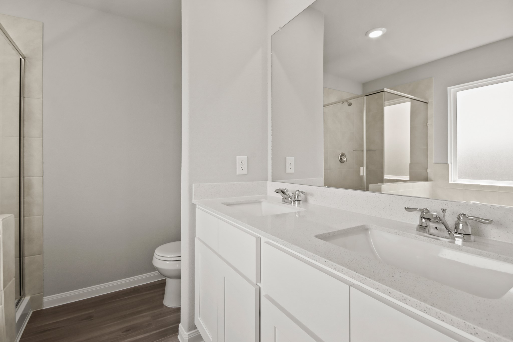 9227 Grace Rdg Drive Willis, TX 77318 - Photo 9 of 23 a bathroom with a sink a toilet and a large mirror